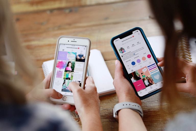 looking over the shoulder of two women on their phones